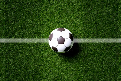 Football on Centre Line of Striped Pitch